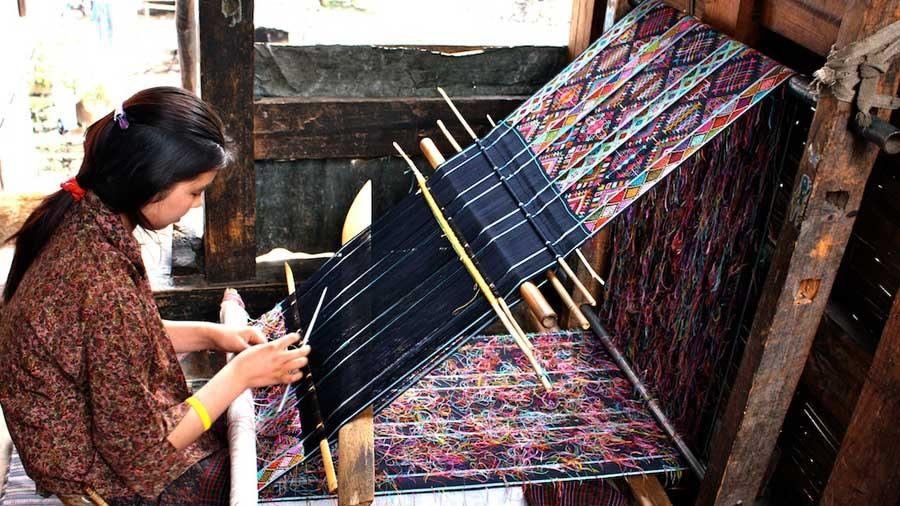 Bhutanese weaver at a traditional loom