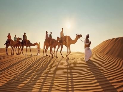 Sunrise camel trek across the dunes