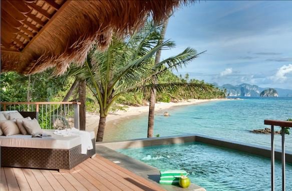 Thatched villa with a private plunge pool overlooking an El Nido beach