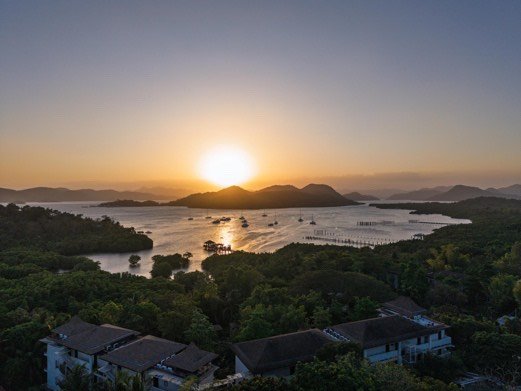 Sunrise over Coron Bay seen from a hillside resort