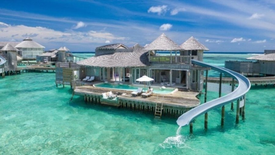 Overwater villa with private water slide
