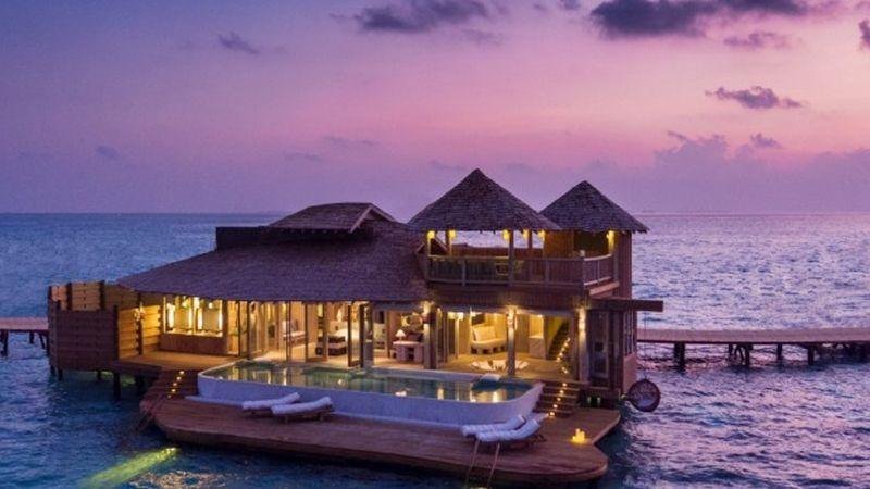 Overwater villa at sunset, Soneva Jani